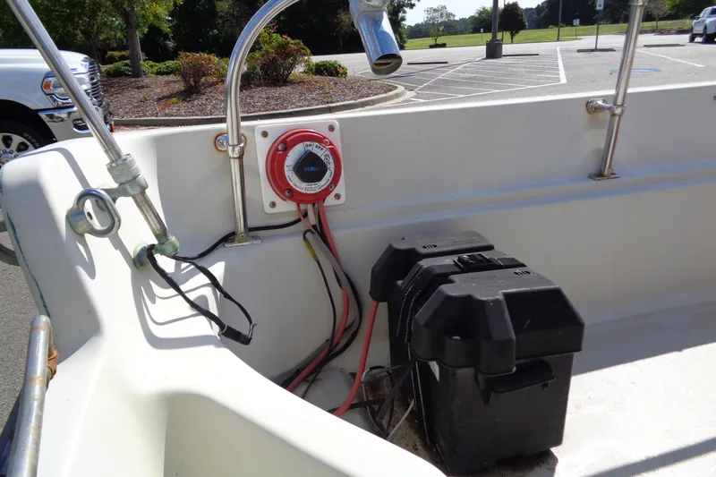 Slide: The Image of 1986 Boston Whaler Montauk 17 CC boat interior with battery and wiring details. - 14
