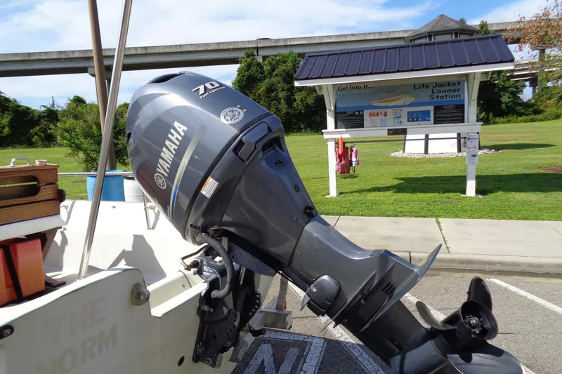 Slide: The Image of 1986 Boston Whaler Montauk 17 CC with Yamaha 70 outboard motor near life jacket station. - 3