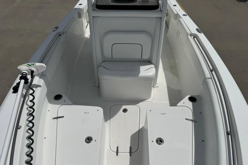 Slide: The Image of 2014 Sea Hunt Gamefish 25 boat interior with seating and storage compartments. - 11