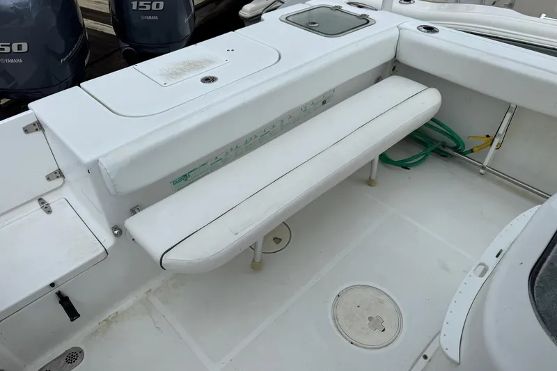 Slide: The Image of 2014 Sea Hunt Gamefish 25 boat interior with Yamaha engines and seating area. - 21