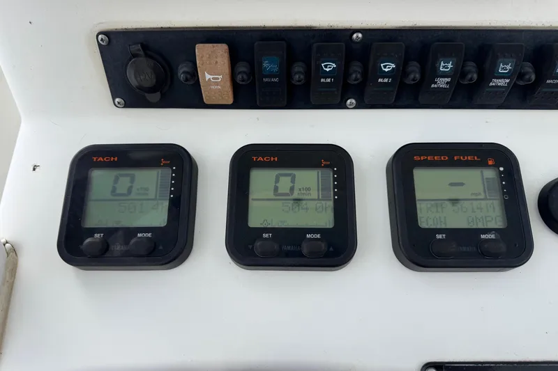 Slide: The Image of Control panel of a 2014 Sea Hunt Gamefish 25 boat with digital displays. - 24