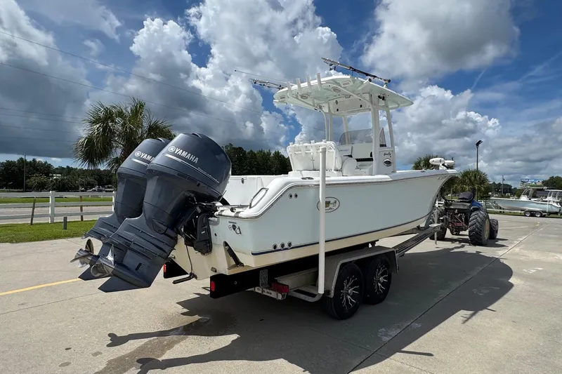 Slide: The Image of 2014 Sea Hunt Gamefish 25 boat on trailer with dual Yamaha engines. - 4