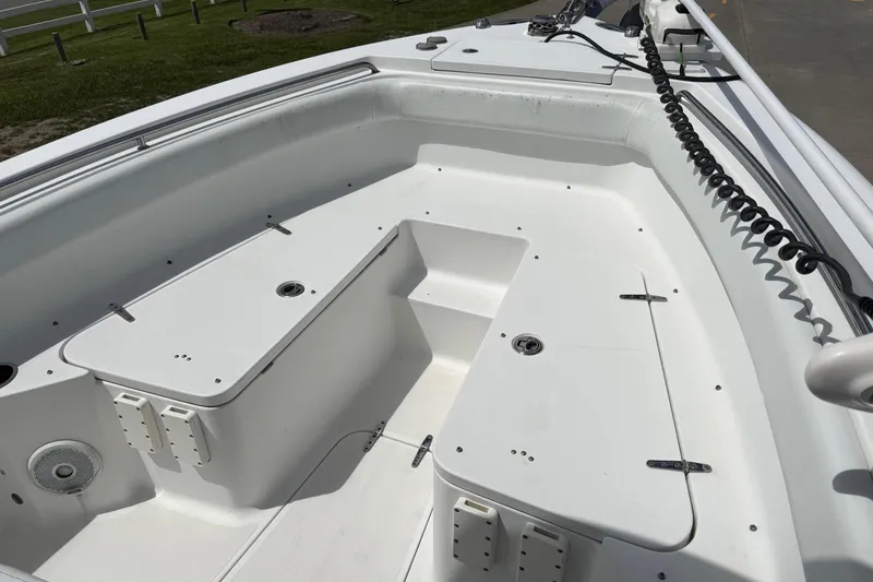 Slide: The Image of 2014 Sea Hunt Gamefish 25 boat interior with storage compartments and seating. - 9