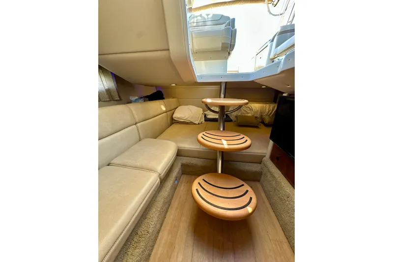 Slide: The Image of Interior of 2015 Formula 350 Crossover Bowrider I/O with cozy seating and wooden steps. - 21