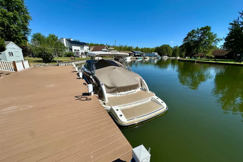 Slide: The Image of 2015 Formula 350 Crossover Bowrider I/O docked on a sunny day. - 3