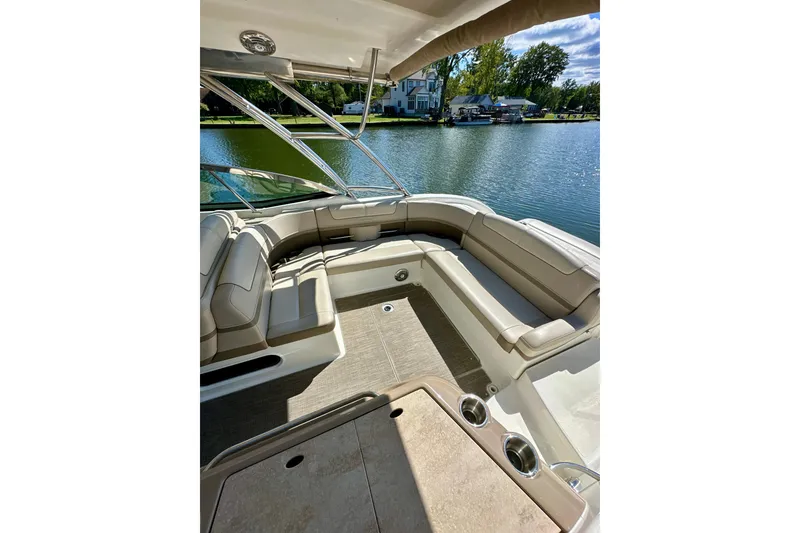 Slide: The Image of 2015 Formula 350 Crossover Bowrider I/O interior with lake view, featuring spacious seating. - 5