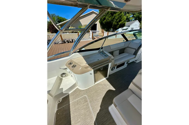 Slide: The Image of 2015 Formula 350 Crossover Bowrider I/O interior with seating and deck view. - 9