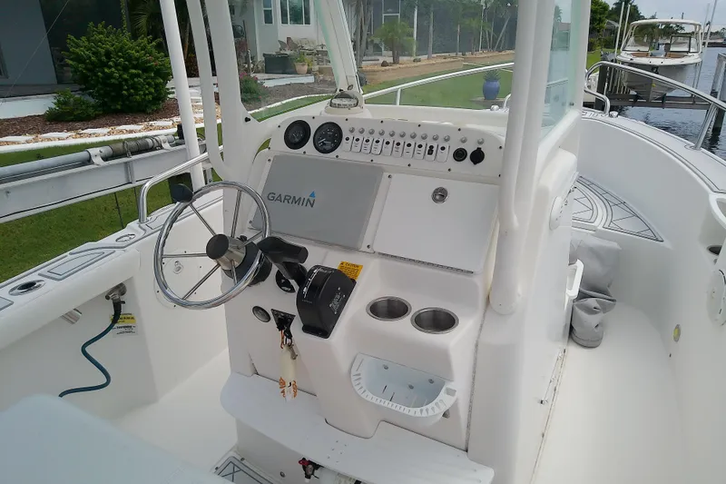 Slide: The Image of 2008 Everglades 210CC boat console with Garmin navigation system and steering wheel. - 16