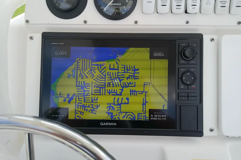 Slide: The Image of Garmin GPS display on 2008 Everglades 210CC boat dashboard, showing nautical map. - 23