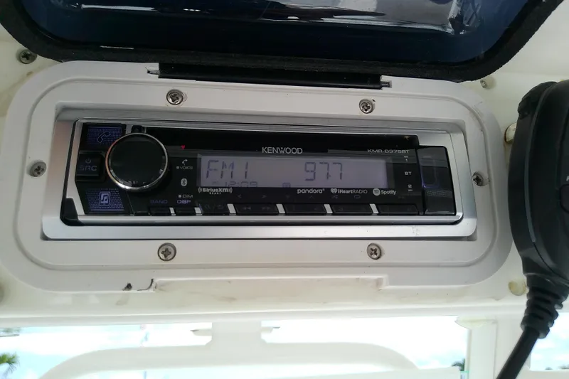 Slide: The Image of Kenwood stereo system on 2008 Everglades 210CC boat, displaying FM 97.7 frequency. - 24