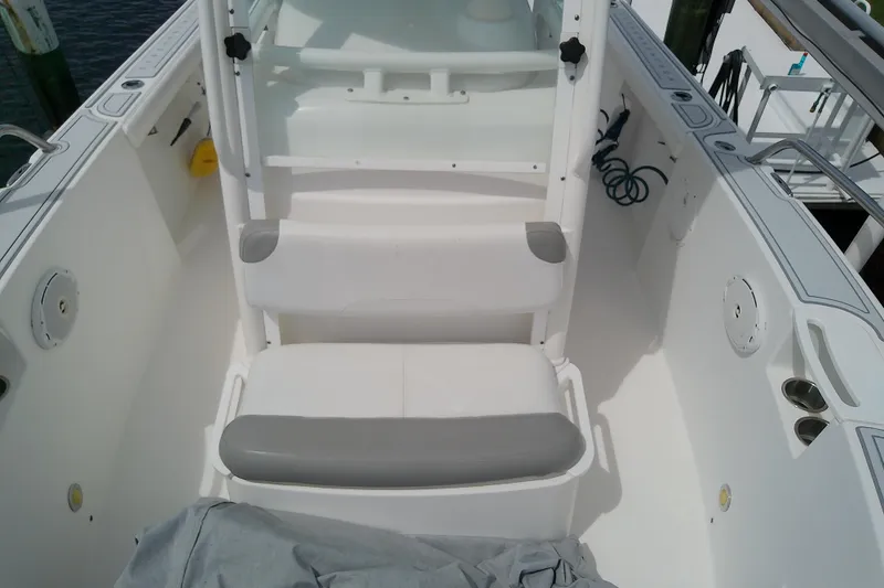 Slide: The Image of 2008 Everglades 210CC boat interior with seating and storage compartments. - 28