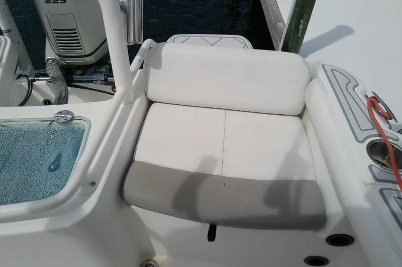 Slide: The Image of White seating area on a 2008 Everglades 210CC boat, near water. - 31