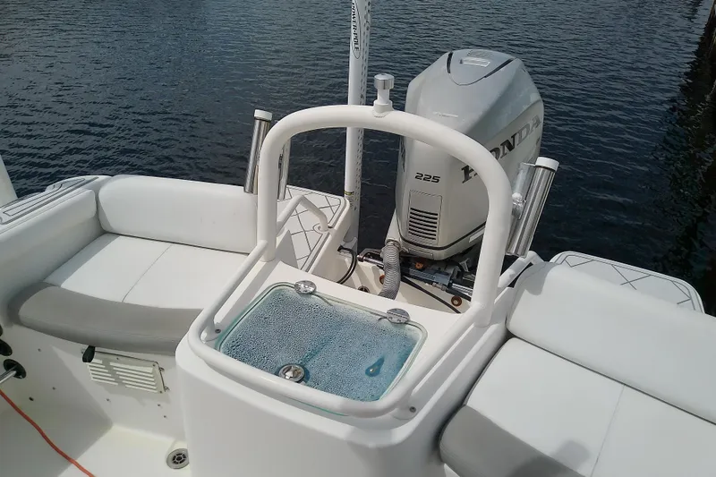 Slide: The Image of 2008 Everglades 210CC boat with Honda 225 outboard motor on calm water. - 32