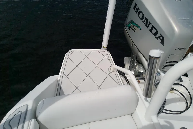 Slide: The Image of 2008 Everglades 210CC boat with Honda 225 outboard motor on water. - 34