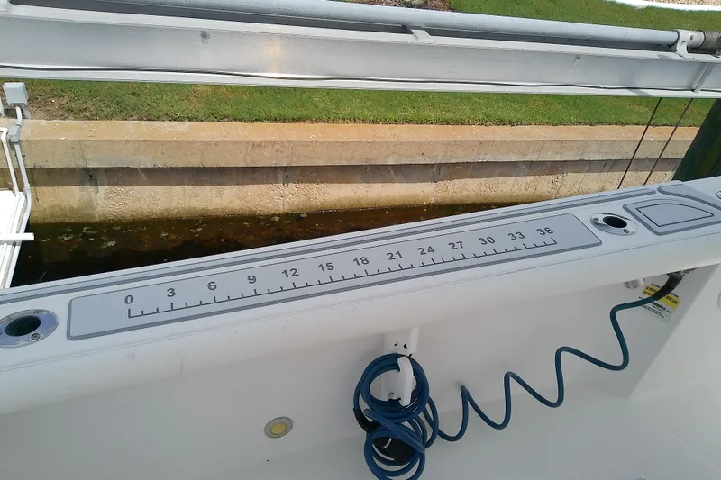 Slide: The Image of 2008 Everglades 210CC boat with built-in measuring ruler on deck. - 38