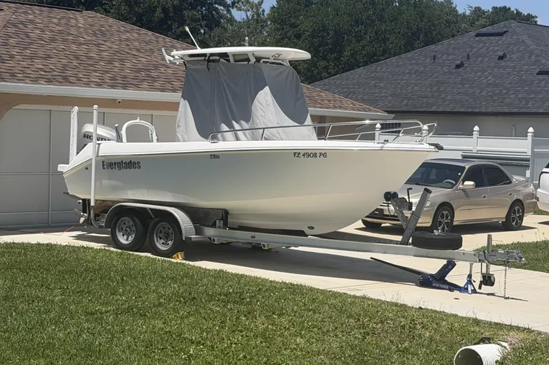 Slide: The Image of 2008 Everglades 210 Center Console boat on trailer in driveway. - 61