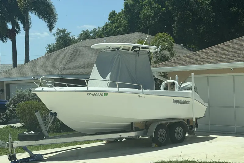 Slide: The Image of 2008 Everglades 210 Center Console boat on trailer in residential driveway. - 62