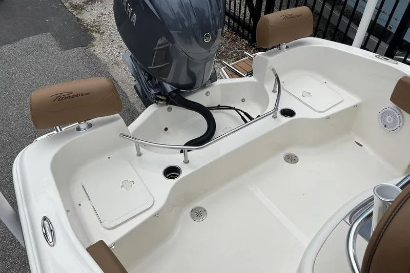 Slide: The Image of 2025 Pioneer 202 Sportfish boat interior with Yamaha outboard motor and seating. - 17