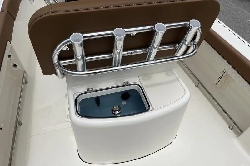 Slide: The Image of 2025 Pioneer 202 Sportfish boat with rod holders and livewell. - 18