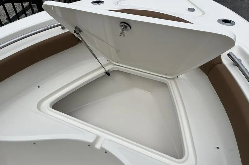 Slide: The Image of Open storage compartment on 2025 Pioneer 202 Sportfish boat. - 6