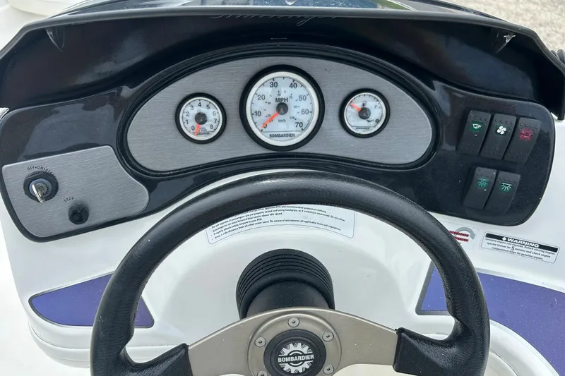 Slide: The Image of Close-up of 2003 Sea Doo 2000 control levers on a boat dashboard. - 13