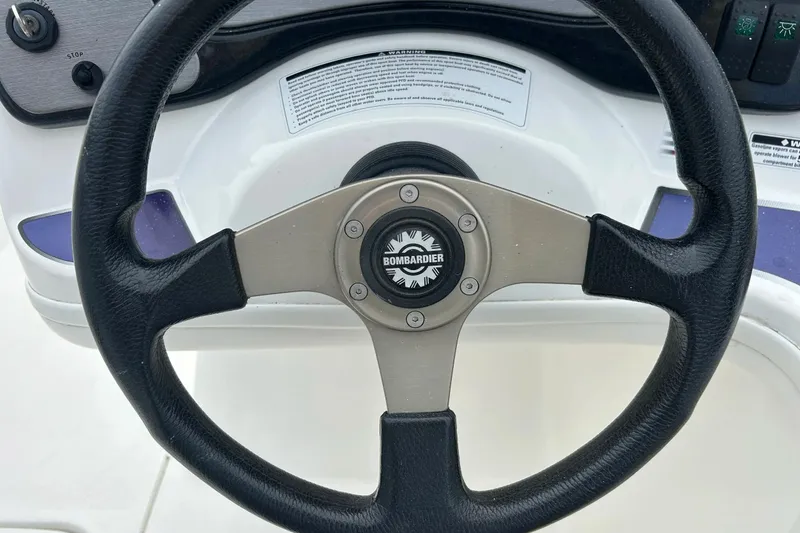 Slide: The Image of Dashboard of a 2003 Sea Doo 2000, featuring gauges and controls. - 14