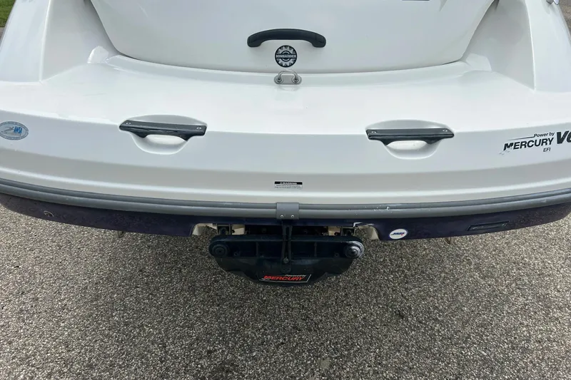 Slide: The Image of Rear view of a 2003 Sea Doo 2000 boat with Mercury V6 EFI engine. - 26