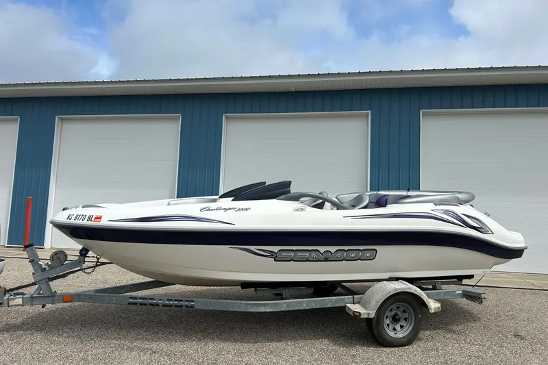 Slide: The Image of 2003 Sea Doo Challenger 2000 boat with sleek design and stylish graphics. - 28