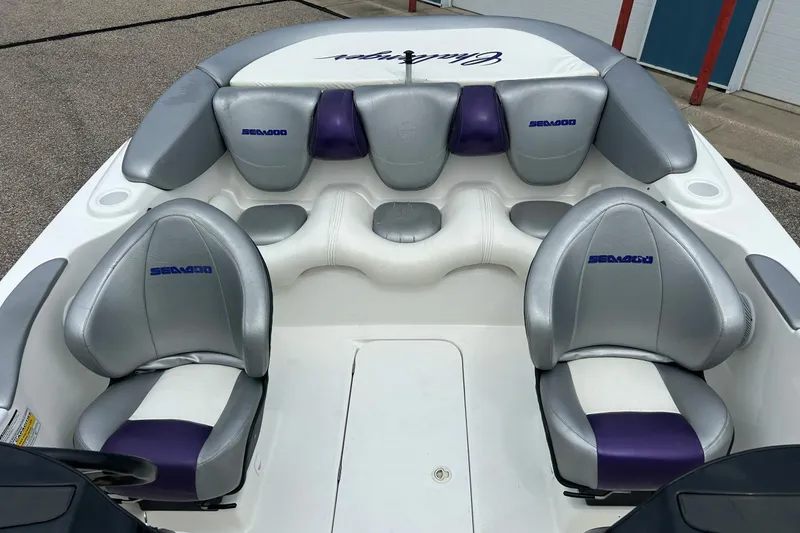 Slide: The Image of 2003 Sea Doo 2000 boat interior with silver and purple seating. - 3