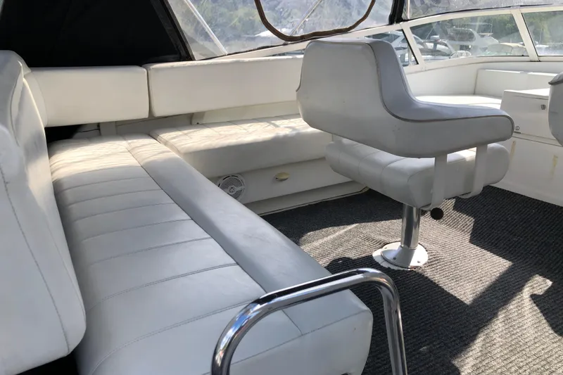 Slide: The Image of Interior of 2001 Carver 374 Voyager with white seating and carpeted floor. - 11