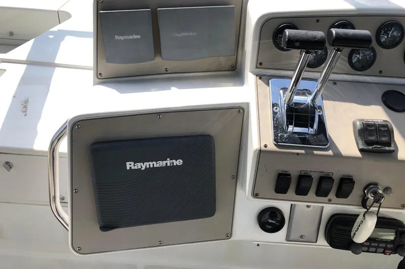 Slide: The Image of Control panel of a 2001 Carver 374 Voyager with Raymarine navigation equipment. - 14