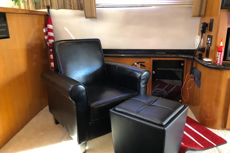 Slide: The Image of Luxurious black leather chair and ottoman in 2001 Carver 374 Voyager interior. - 18