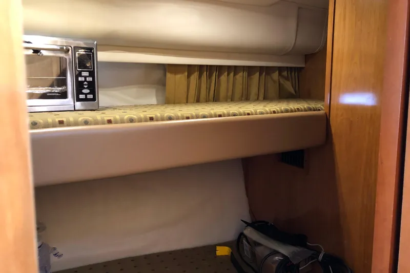 Slide: The Image of 2001 Carver 374 Voyager interior with microwave and storage area. - 23