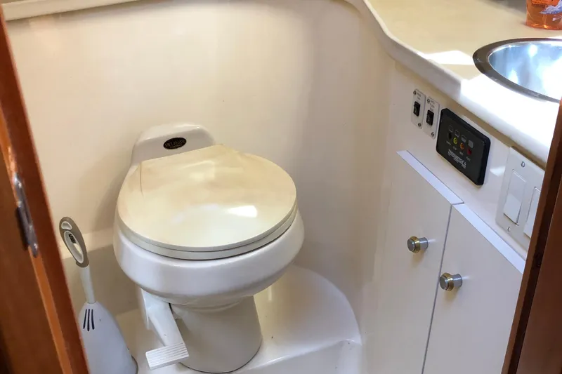 Slide: The Image of 2001 Carver 374 Voyager yacht bathroom with toilet and sink. - 25