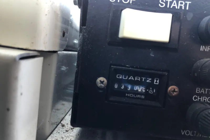 Slide: The Image of Close-up of a 2001 Carver 374 Voyager engine hour meter reading 3306.5 hours. - 30