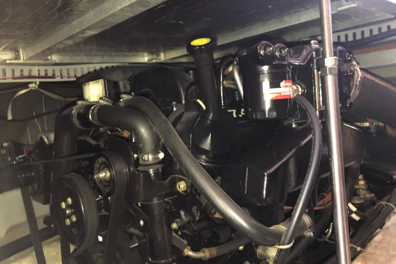 Slide: The Image of Engine compartment of a 2001 Carver 374 Voyager boat, showcasing mechanical components. - 32