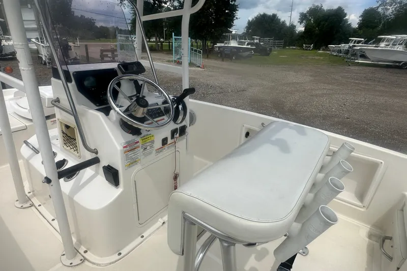 Slide: The Image of 2022 Trophy T-18 boat console with steering wheel and rod holders. - 13