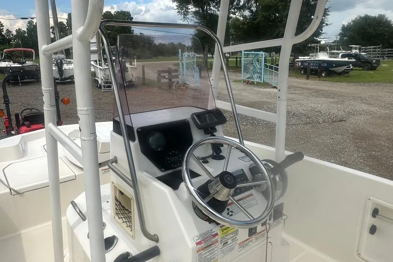 Slide: The Image of Steering console of a 2022 Trophy T-18 boat, featuring a modern helm design. - 14