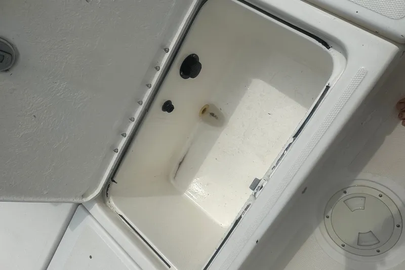 Slide: The Image of Open storage compartment on 2022 Trophy T-18 boat deck. - 15