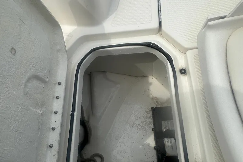 Slide: The Image of Open storage compartment on a 2022 Trophy T-18 boat, showing interior details. - 18