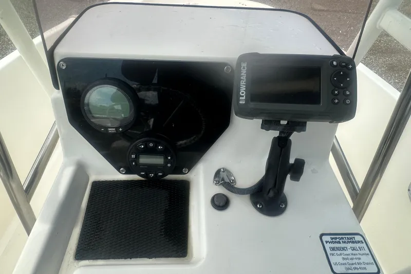 Slide: The Image of 2022 Trophy T-18 boat dashboard with Lowrance device and control panel. - 21