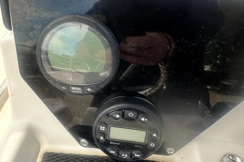 Slide: The Image of Control panel of a 2022 Trophy T-18 boat with digital displays and buttons. - 23