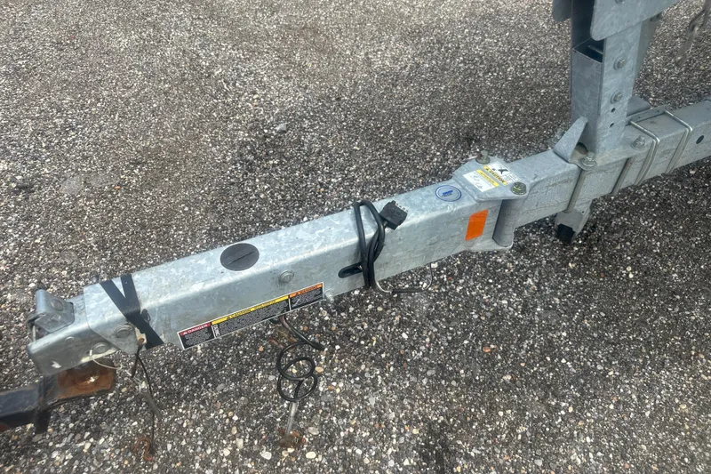 Slide: The Image of Trailer hitch of a 2022 Trophy T-18 on gravel surface. - 24