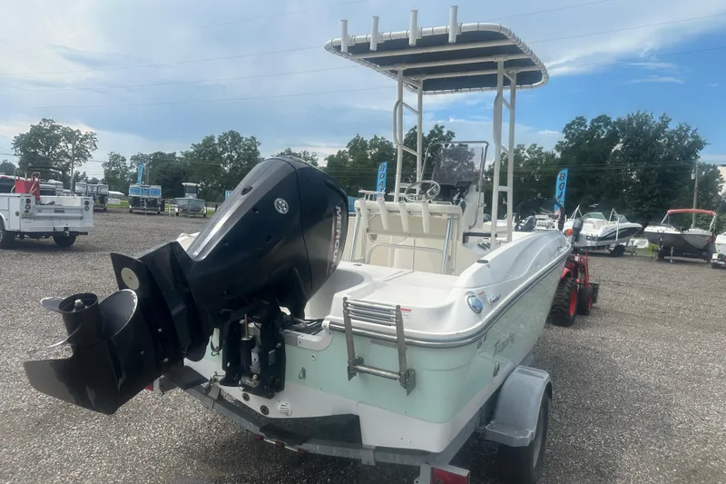 Slide: The Image of 2022 Trophy T-18 boat with Mercury outboard motor on a trailer in a dealership lot. - 5