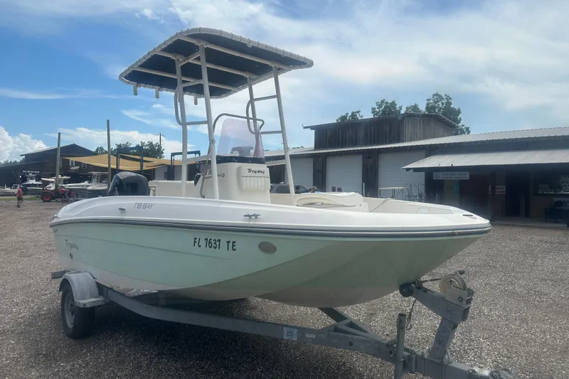 Slide: The Image of 2022 Trophy T-18 boat on trailer in outdoor storage area. - 8