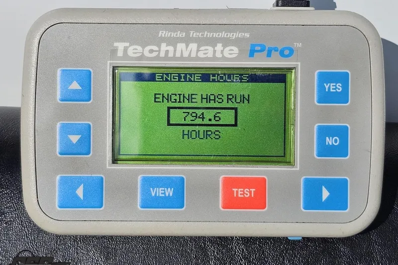Slide: The Image of TechMate Pro engine hour meter displaying 794.6 hours for 2005 Baja 275. - 100