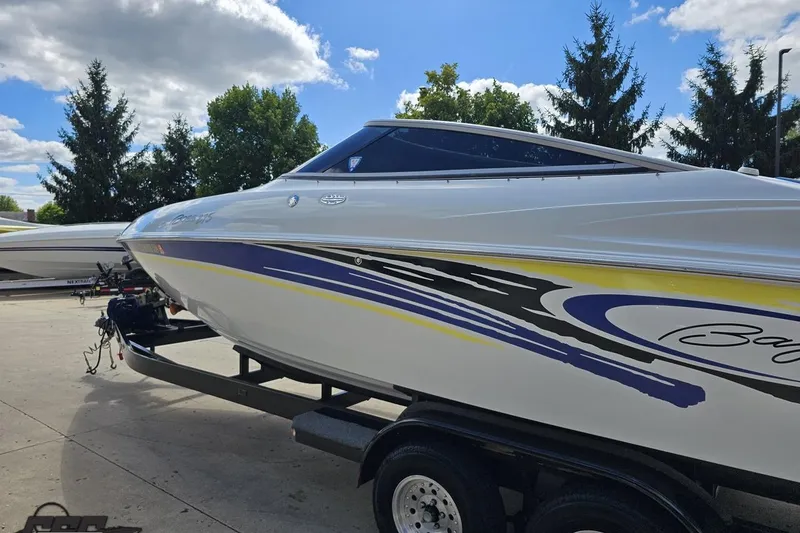 Slide: The Image of 2005 Baja 275 boat on trailer, featuring sleek design and vibrant graphics. - 24