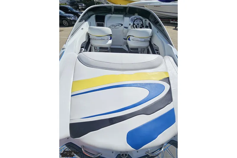 Slide: The Image of 2005 Baja 275 boat interior with colorful seating and dashboard view. - 37