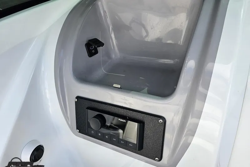 Slide: The Image of 2005 Baja 275 boat dashboard with Fusion audio system and USB port. - 56