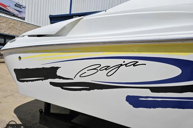 Slide: The Image of 2005 Baja 275 boat with sleek design and vibrant graphics. - 6